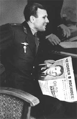 Gagarin holds the "Komsomolskaya pravda" newspaper in his hands.