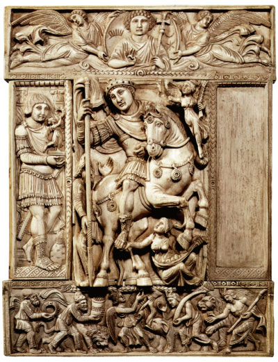 Justinian I (?). The "Barberini Ivory". Paris, the Louvre :: The only leaf of an imperial diptych. The triumphant Emperor - perhaps Justinian himself - is shown mounted on a rearing charger, accompanied by a figure of Victory; he has subjugated the Scythian or Persian walking by his side; Earth, seated on the ground, opens a fold of her mantle laden with her fruits and clasps the foot of the victorious Emperor. In the top panel, set in a mandorla borne by two angels, Christ appears giving his blessing.